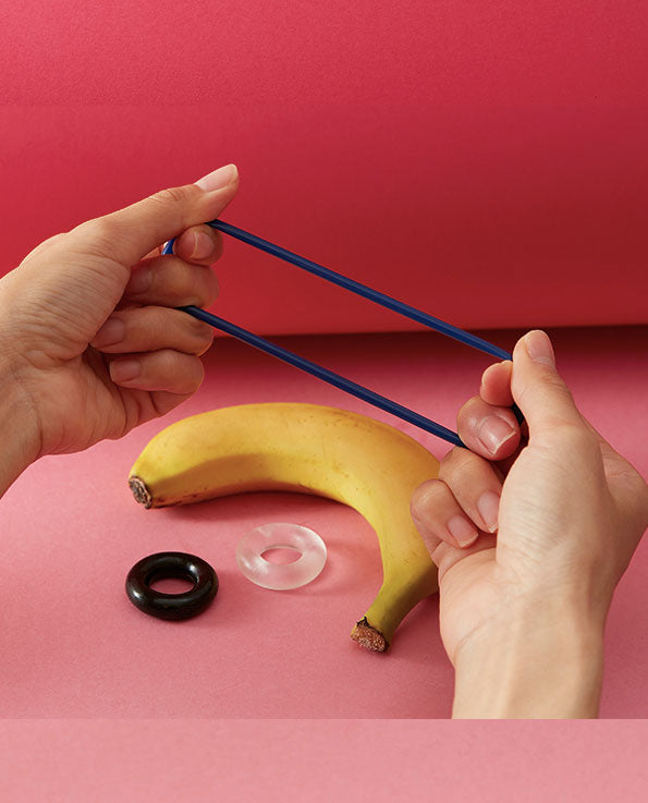 hand stretching blue jelly cock ring, black and transparent jelly cock ring, banana